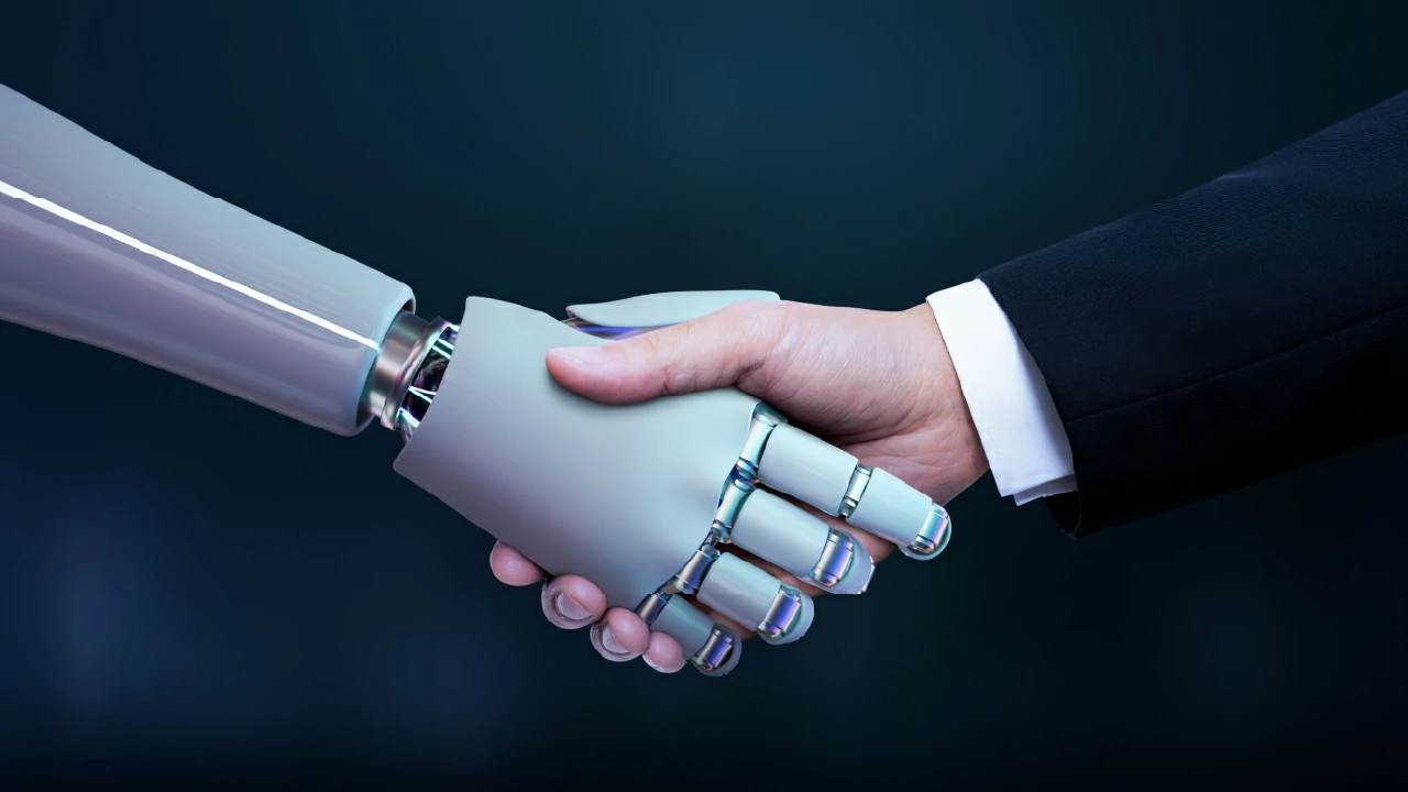Inteligencia artificial y humano dándose la mano